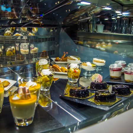 Malak Regency Hotel Ilidza Exterior photo A display of desserts